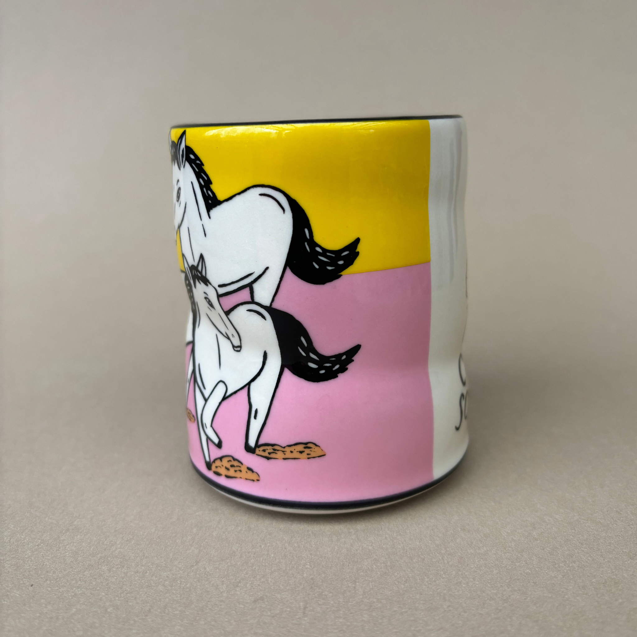 Trust Soul Spark Cup - Large by The Bowl Maker displays a playful illustration of unicorns in motion, highlighting an artistic and unique ceramic design.