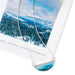Tahoe Snow Necklace by Foterra Jewelry, showcasing a unique design featuring a scenic image coated in waterproof UV resistant resin, set on an 18-inch sterling silver chain, presented with a beautiful landscape photograph.