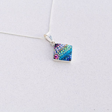 Delicate Diamond Pendant by Mosaico Jewels showcasing its intricate design and sparkling charm.