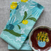 Moonlit Napkin Set arranged beautifully, highlighting the vibrant blue hues and delicate echinacea flowers, perfect for any occasion.