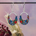 Stylish Crystal Oval Gondola Earrings from Mosaico Jewels, showcasing delicate craftsmanship with a sheen that catches the light beautifully.