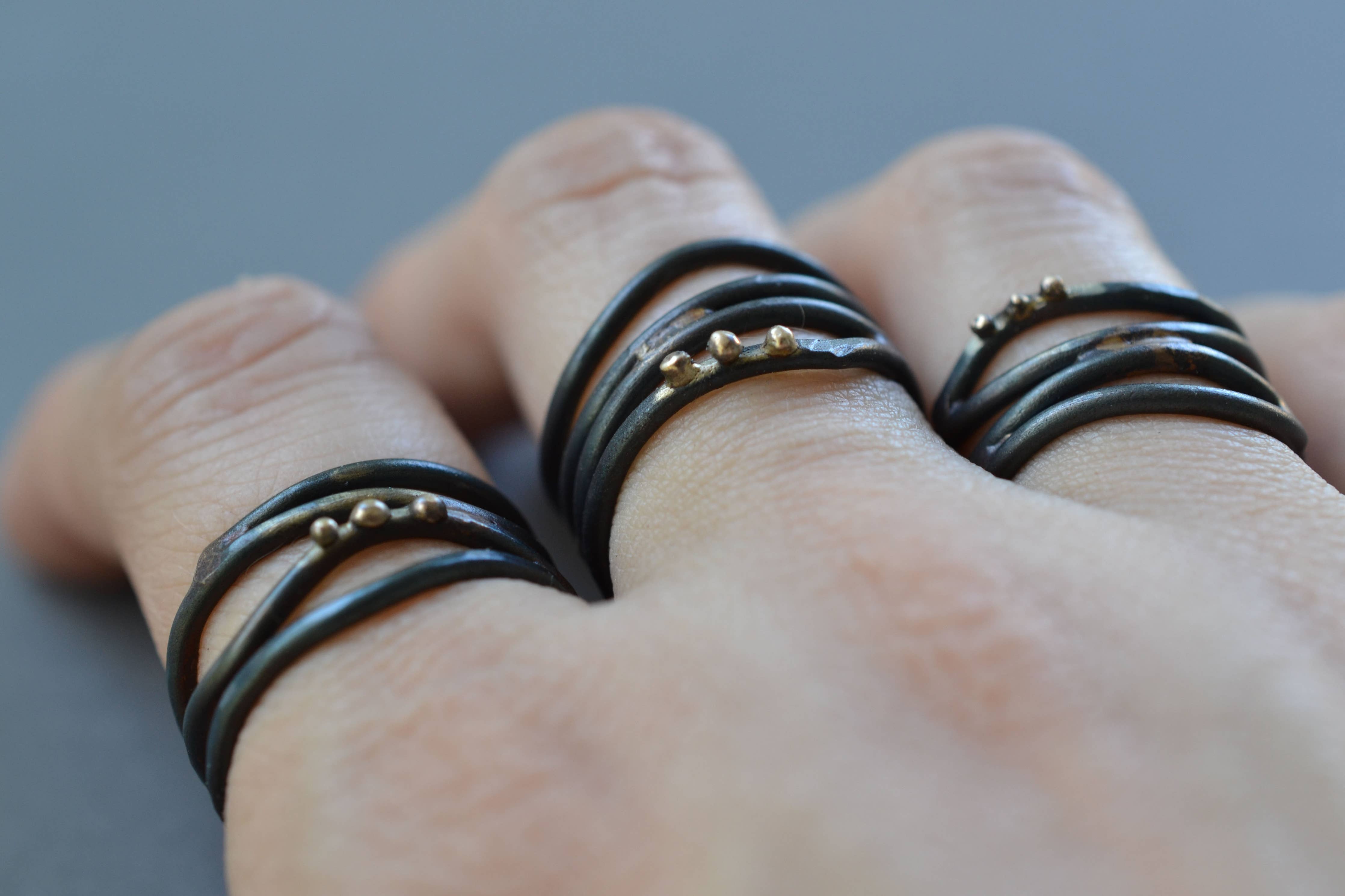 View the Linear Wrap Ring in all its glory: a beautiful blend of steel and recycled 10k gold, perfect for finger fashionistas!