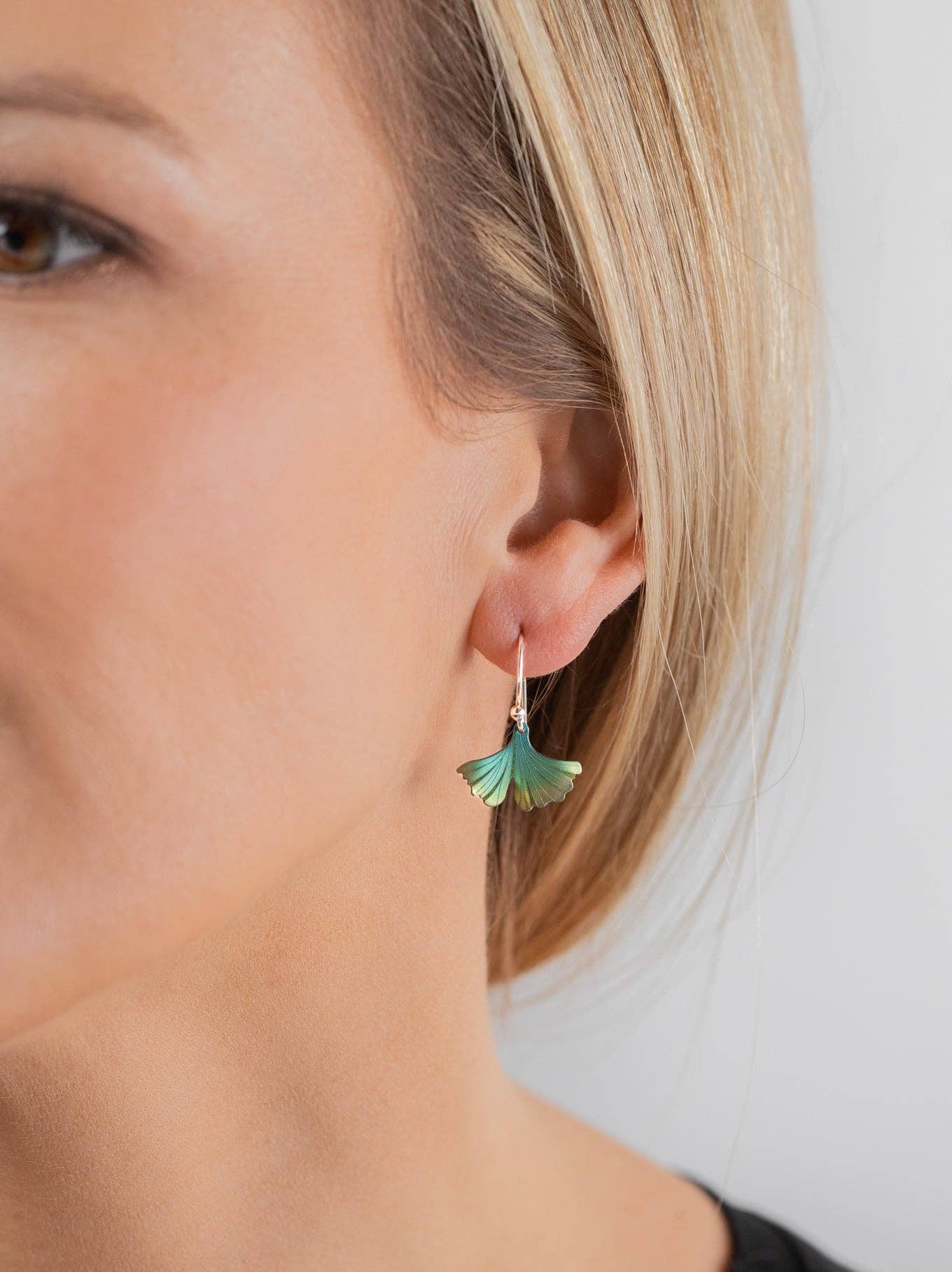 Close-up of the gorgeous Petite Ginkgo Earrings, perfect for adding a touch of nature's whimsy to your ear game.