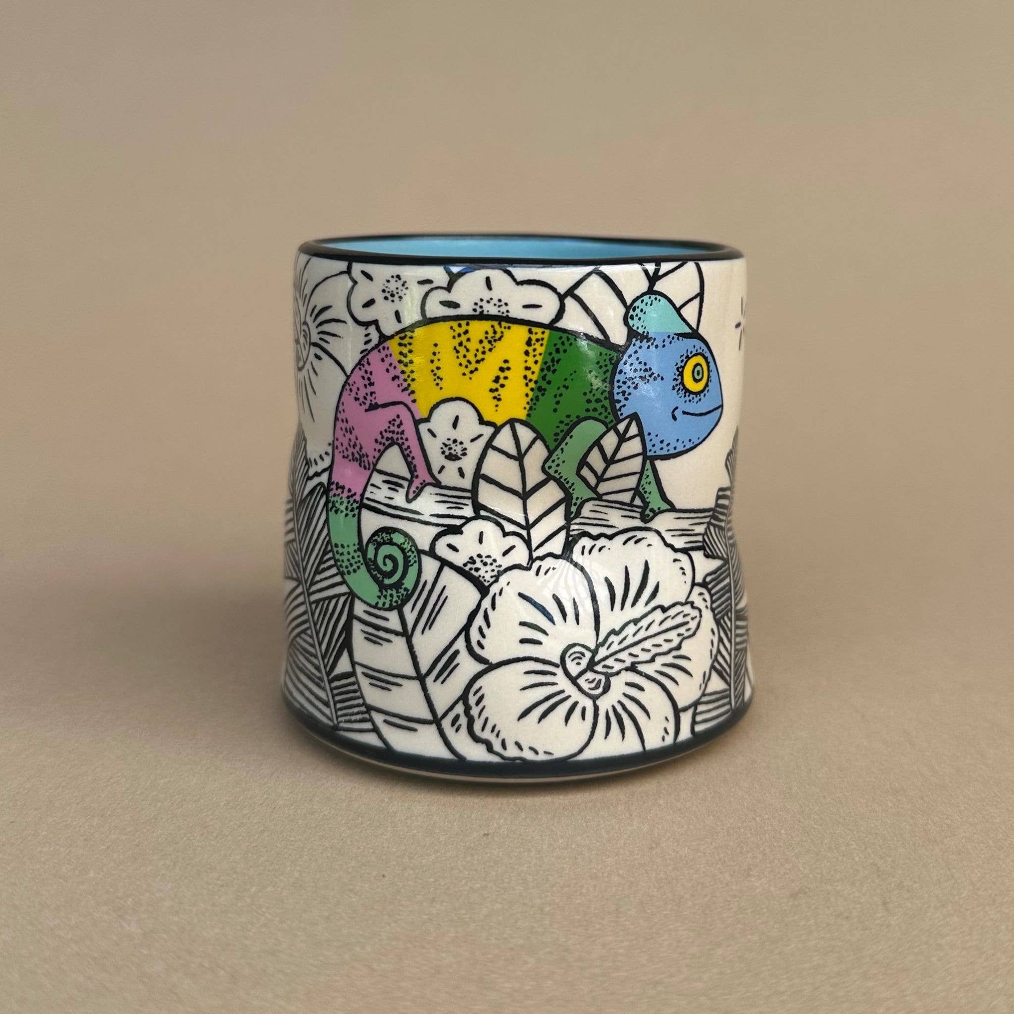 Lucky Chameleon Cup - Medium by The Bowl Maker, featuring a vibrant chameleon design surrounded by floral patterns, perfect for kids and art lovers, dishwasher safe.
