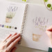 Colorful cover of the Garden Watercolor Workbook by Emily Lex Studio, featuring beautiful watercolor illustrations of garden themes.