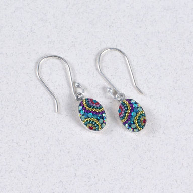 Elegant Crystal & Silver Oval Earrings showcasing delicate craftsmanship and a shimmering design.