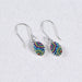 Elegant Crystal & Silver Oval Earrings showcasing delicate craftsmanship and a shimmering design.