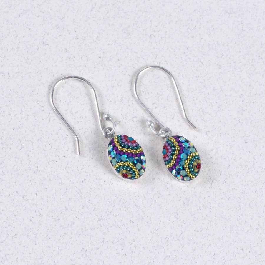 Elegant Crystal & Silver Oval Earrings showcasing delicate craftsmanship and a shimmering design.