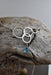 Close-up of the Aqua Eco Glass Sterling Silver Circle Necklace featuring the handcrafted aqua Eco Glass teardrop pendant with a frosted finish.