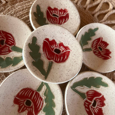 Handmade Red Poppy Tea Rest mini dishes by Tough Kitty Designs, featuring beautiful red poppy designs against a speckled background, perfect for holding trinkets or tea bags.