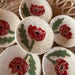 Handmade Red Poppy Tea Rest mini dishes by Tough Kitty Designs, featuring beautiful red poppy designs against a speckled background, perfect for holding trinkets or tea bags.