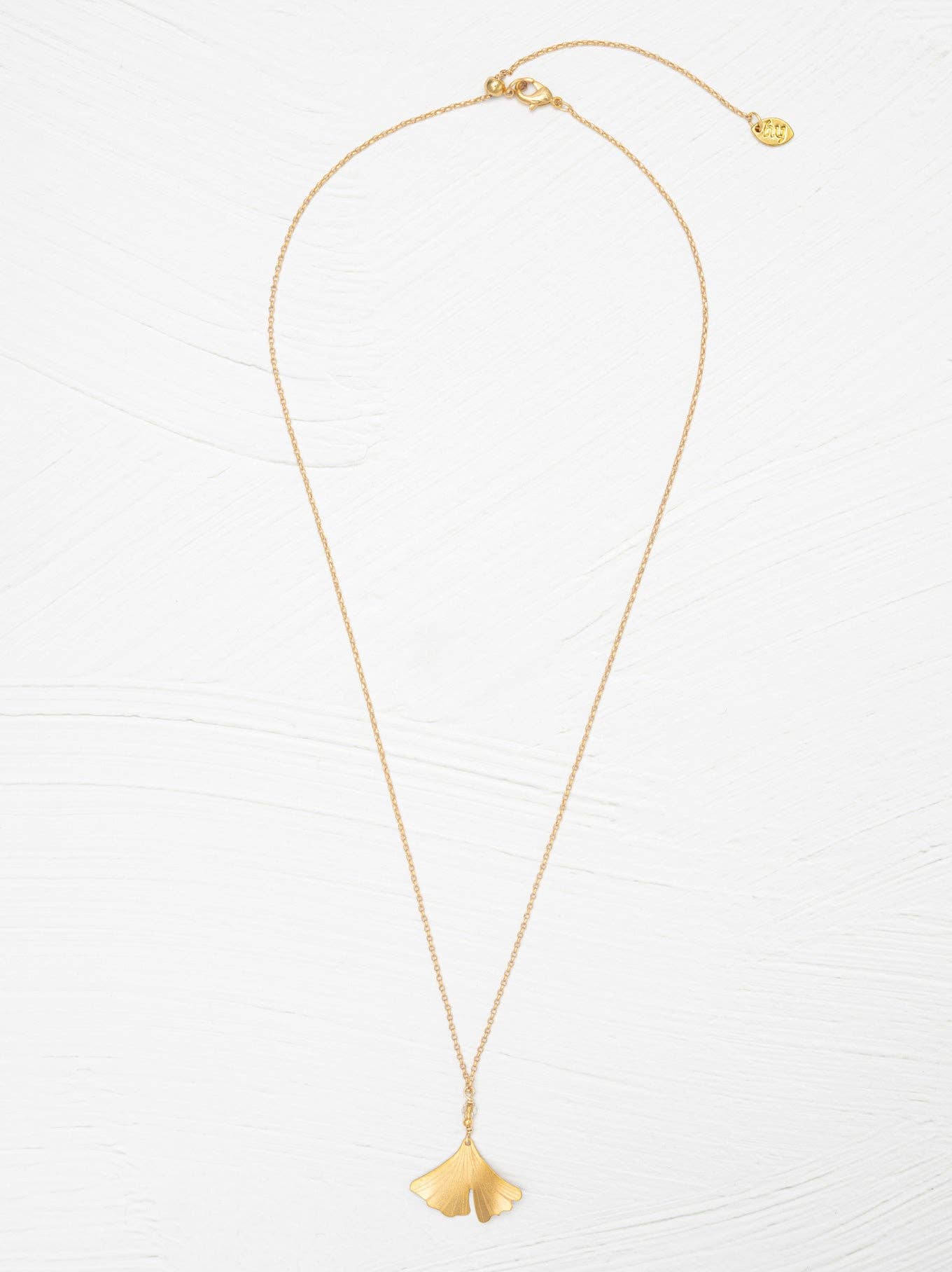 Dazzle with simplicity! The Petite Ginkgo Pendant Necklace flaunts a beautiful golden niobium leaf on a delicate chain, perfect for adding flair without overdoing it.