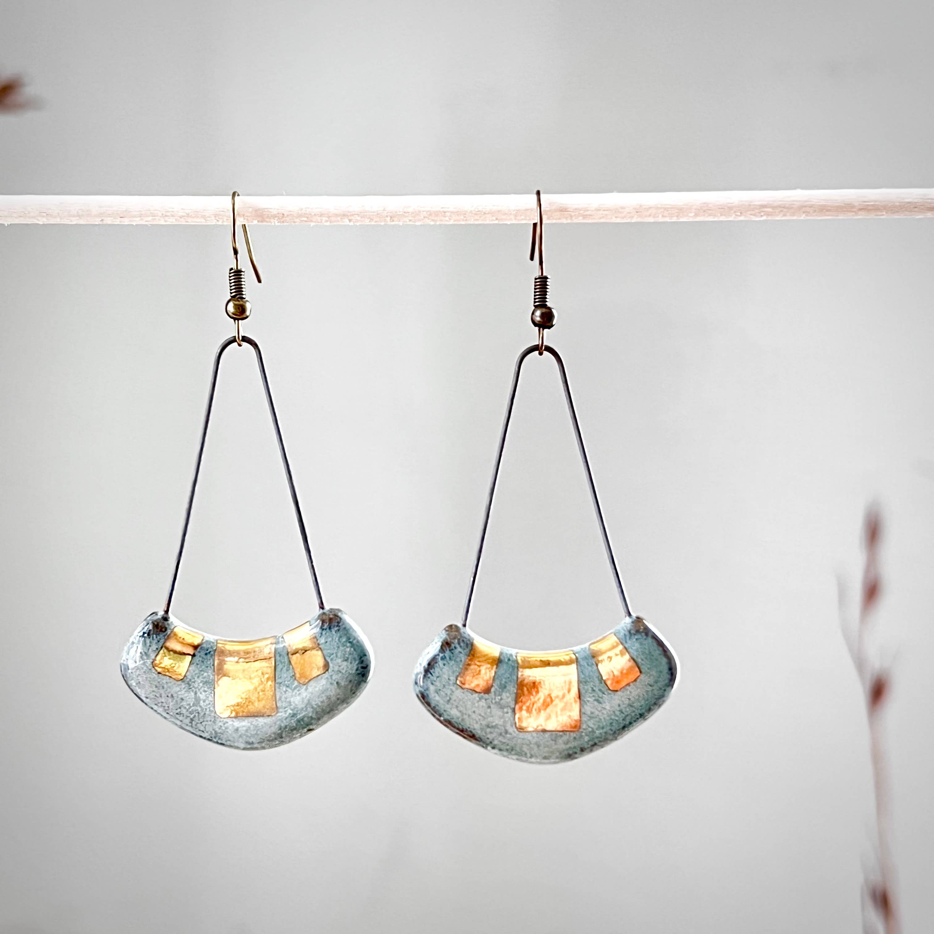 Turquoise and Gold Collar Earrings by The Artifact House, showcasing handcrafted ceramic design with turquoise glaze and 24K gold accents, hanging elegantly.