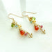 Delightfully sweet Wildflower Earrings with a tiny bee charm, showcasing sparkling gems like peridot and citrine, perfect for those who want their ears to have a buzz!