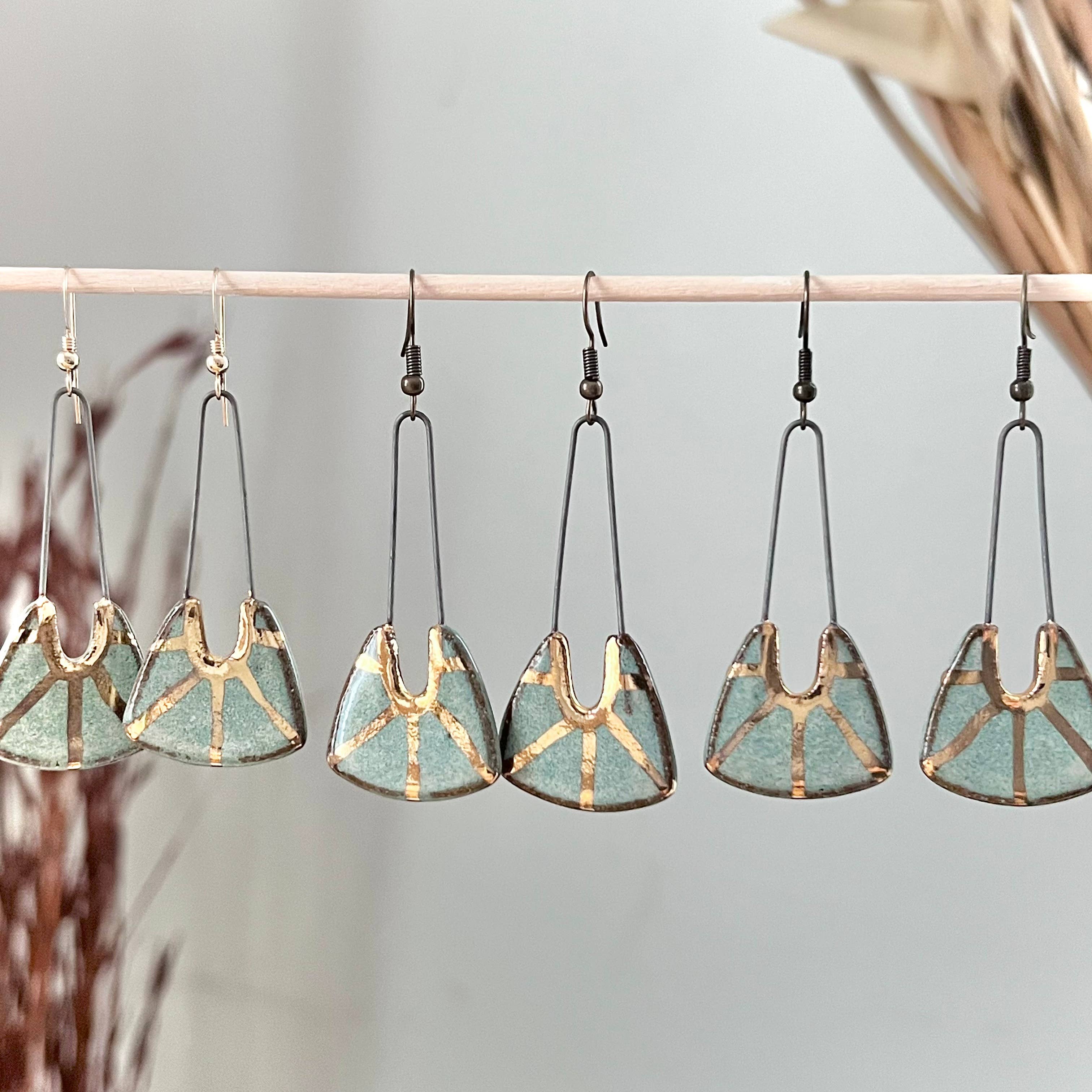 Turquoise Dropped Stoneware Earrings with Gold Sun Design