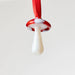 Decorative mushroom ornament with red cap and white stem 