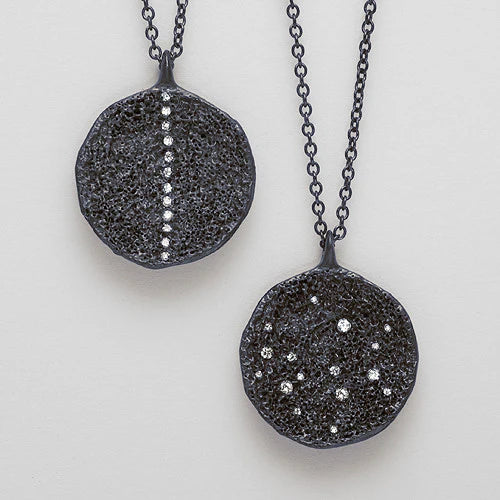Two black druzy diamond pendants on chains 
