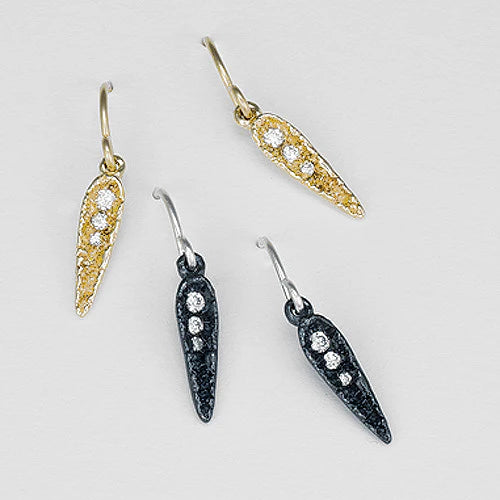 two pairs of diamond earrings in gold, black silver