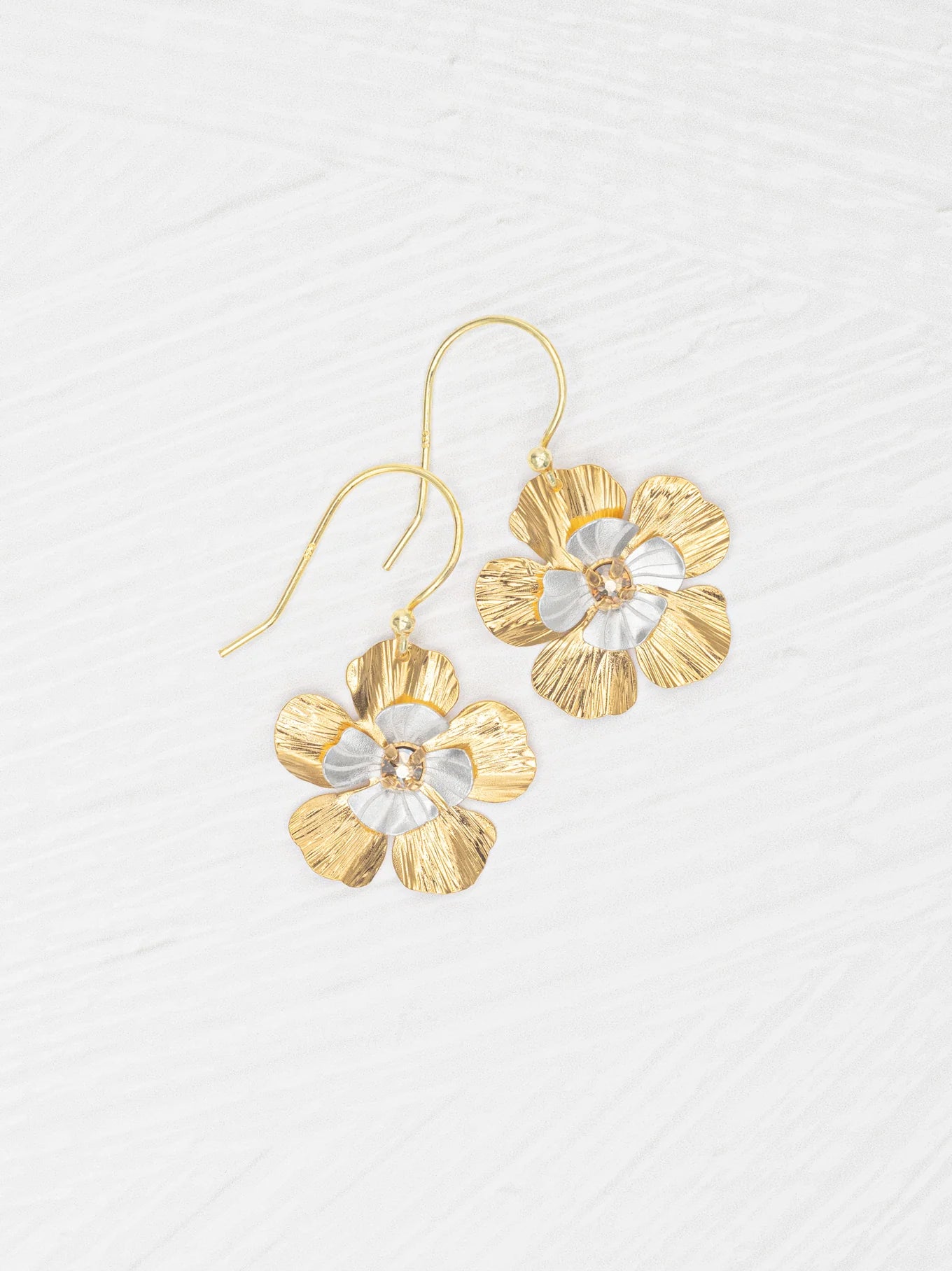 Blissful Bloom Earrings showcasing shimmering petals in mixed-metal with crystal center, handcrafted by Holly Yashi.