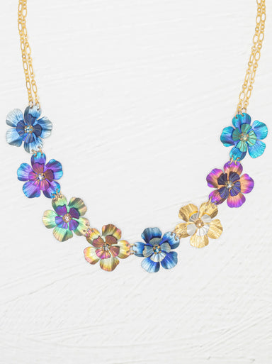 Blissful Bouquet Necklace featuring handcrafted niobium blossoms in shades of indigo, violet, aqua, and gold, adorned with crystal accents on a gleaming chain.