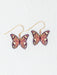 Close-up view of Mariposa Butterfly Earrings, highlighting the intricate craftsmanship and captivating colors that change in light, making each piece a unique accessory.