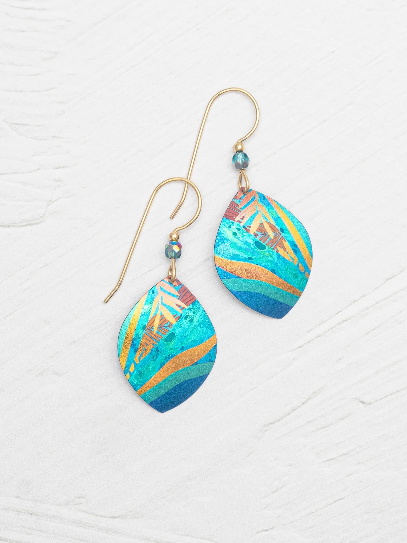 Close-up view of Layla Earrings, showcasing their intricate gold fill details and stylish design.