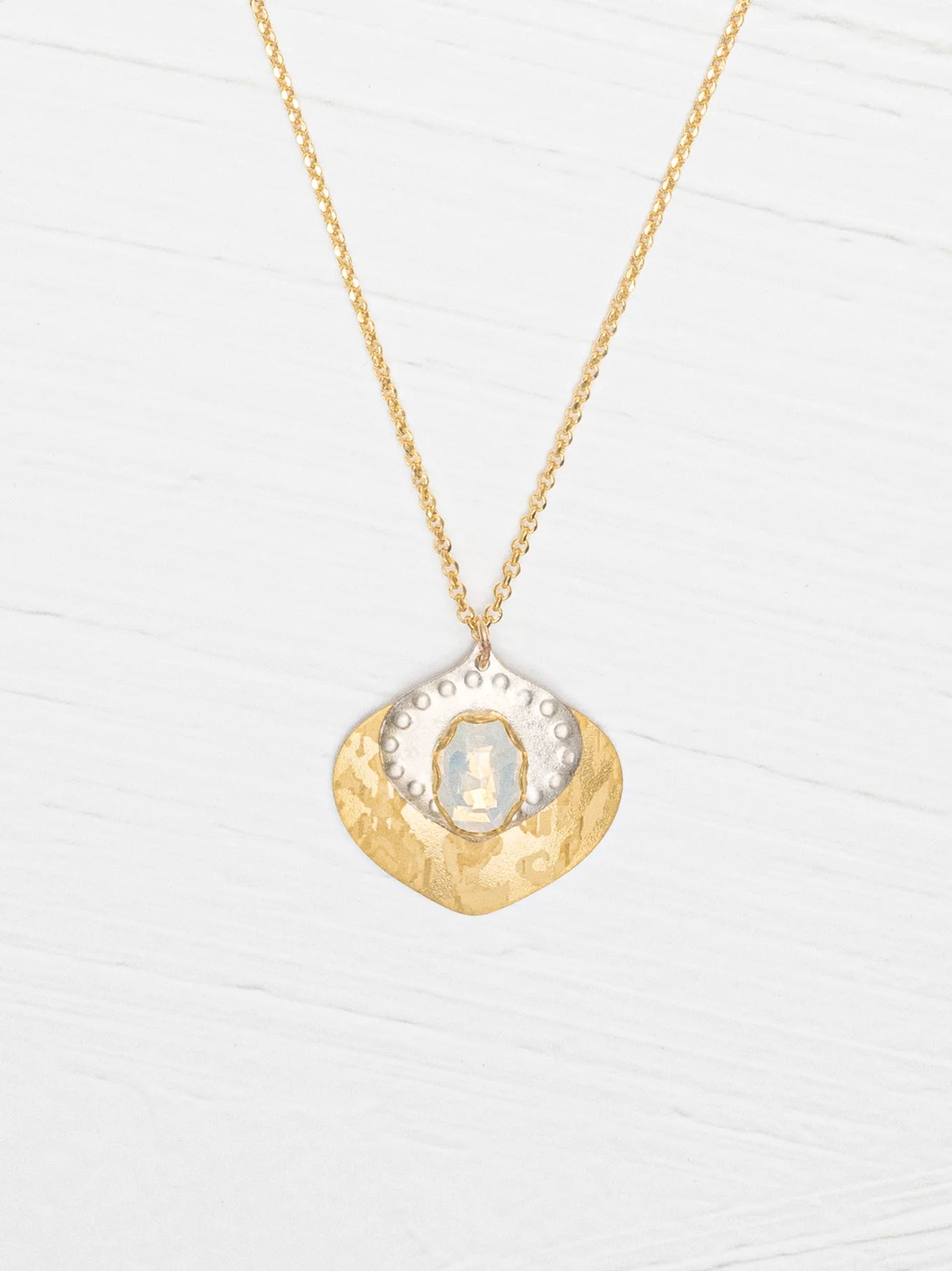 Arabella Pendant Necklace displayed elegantly to showcase its beautiful glass stone and luxurious gold accents.