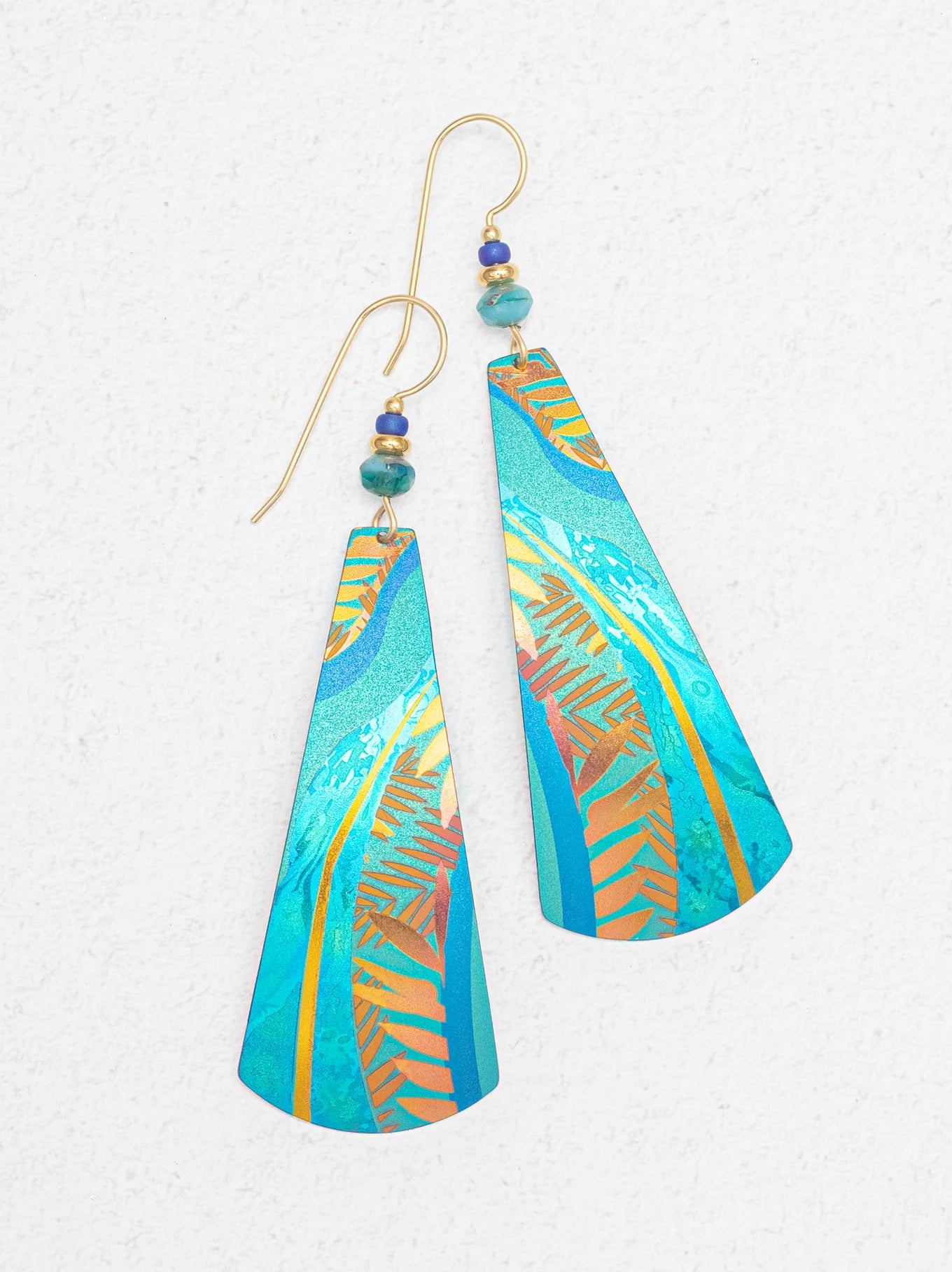 Gaya Earrings by Holly Yashi featuring gold fill ear wires and niobium materials, measuring 3" l. × 7/8" w.