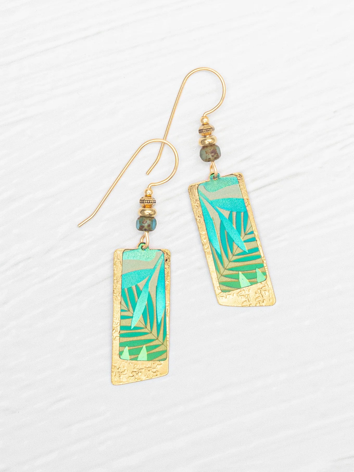 Davy Earrings by Holly Yashi showcasing stunning design with gold fill ear wires and niobium, featuring an elegant 18K gold-plated finish.