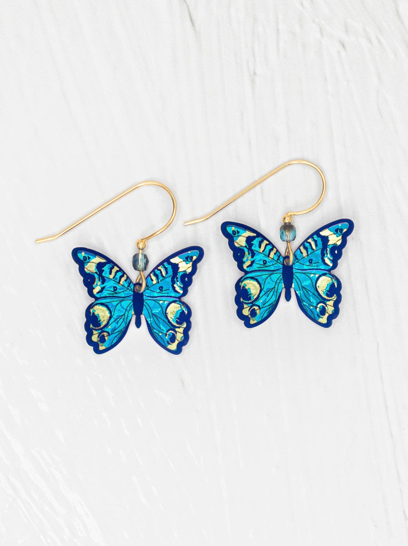 Mariposa Butterfly Earrings showcasing a delicate and vibrant butterfly design, crafted with gold fill ear wires and niobium, perfect for adding a bold touch to any outfit.