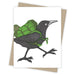 Blackbird carrying a green backpack greeting card