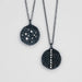 Two black stone pendants on chains 