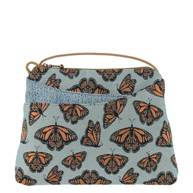 The Sparrow bag perched elegantly, measuring 7.5"h x 9.5"l x 1.75"w, ready to add style to any outfit!