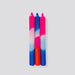 pink and blue tapered candles
