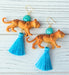 Tiger drop earrings with blue tassel