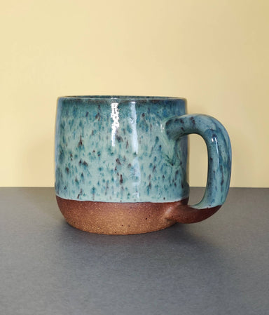 green stoneware mug