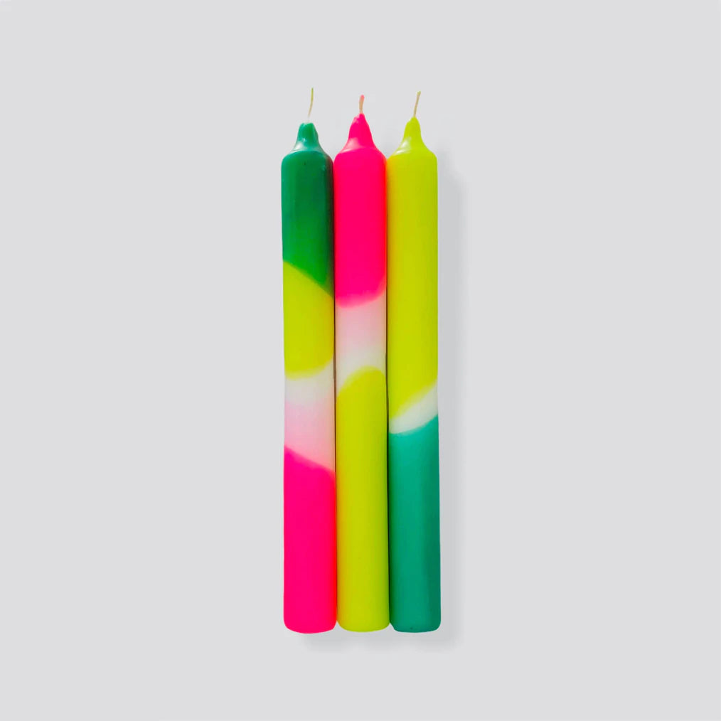 green and yellow tapered candles