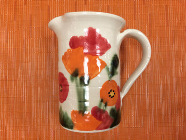 handmade ceramic pitcher with poppies