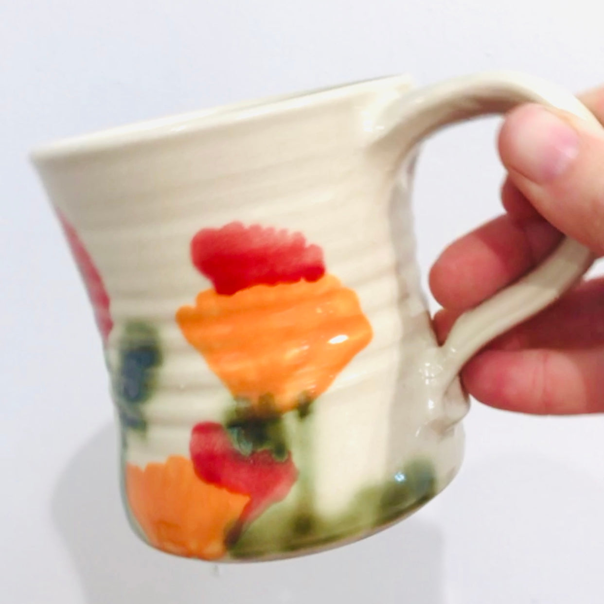 handmade ceramic mug with poppies