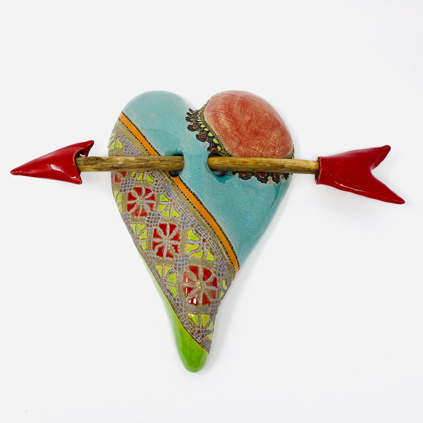 ceramic heart with wooden arrow