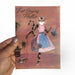 just saying hello cat in a dress greeting card