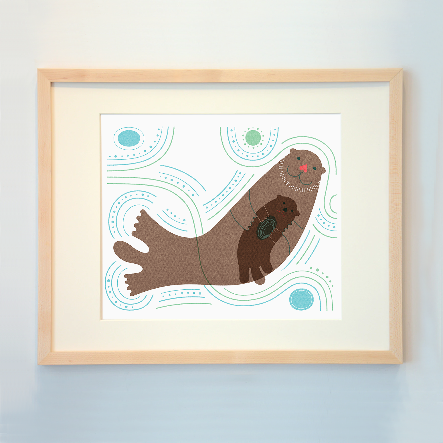 framed sea otter with baby