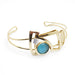 gold cuff bracelet with glass bead